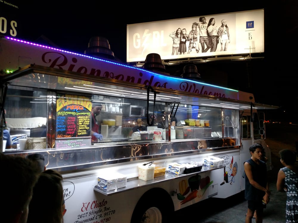 Service window of the El Chato truck at night