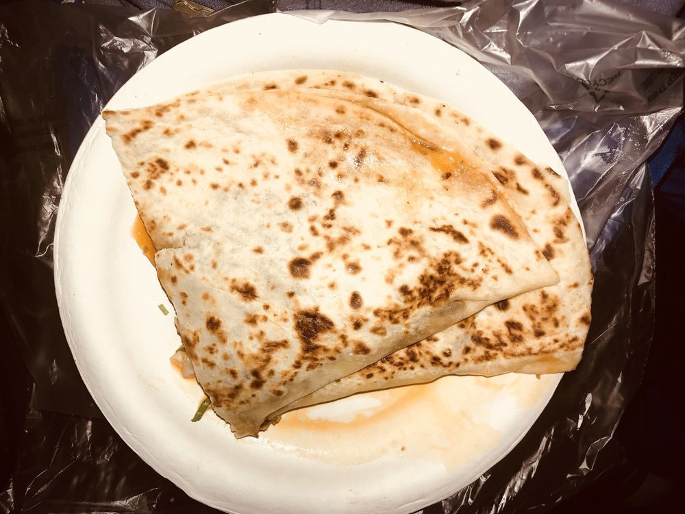Flour tortilla quesadilla on a paper plate
